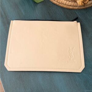 Yves Saint Laurent Beaute beige non leather cosmetic pouch.